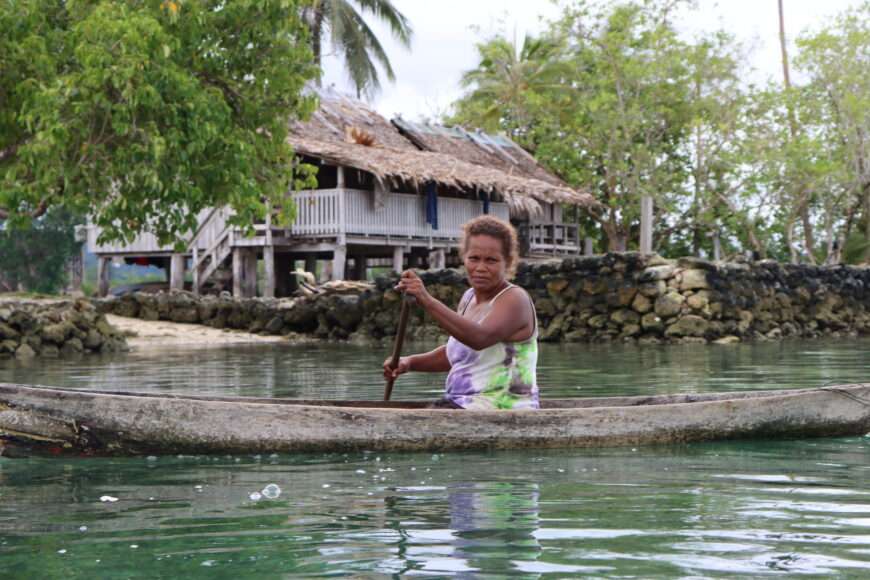 Woman kayaking in the Solomon Islands